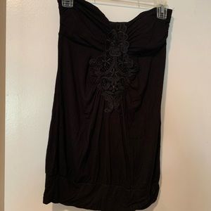 Black strapless top.